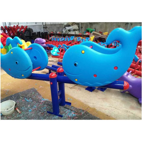 child seesaw outside - Image 6